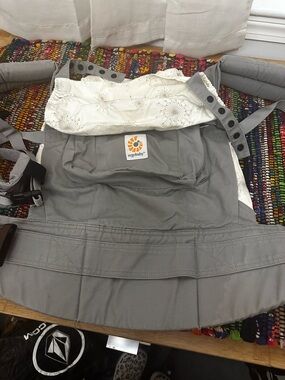 Ergobaby Gray Carrier with starburst Cream Floral Hood